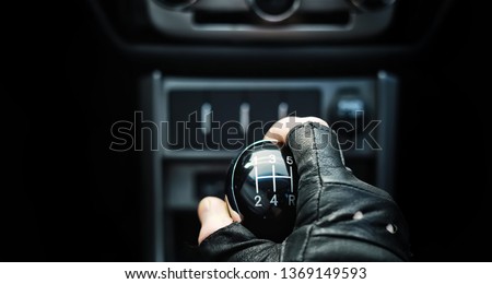 Gear lever. Manual Transmission. Hand on the gear shift in a car.