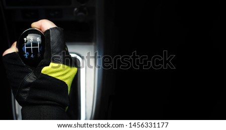 Gear lever. Manual Transmission. Hand on the gear shift in a car.