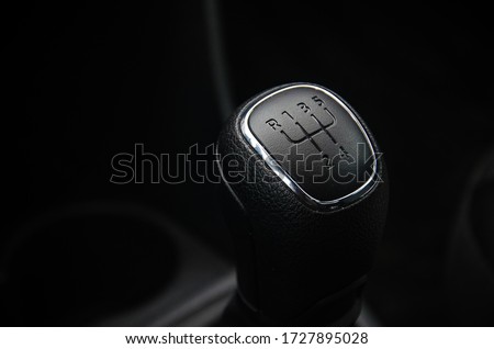 Gear shift handle in a modern car. Manual transmission. The gear change lever