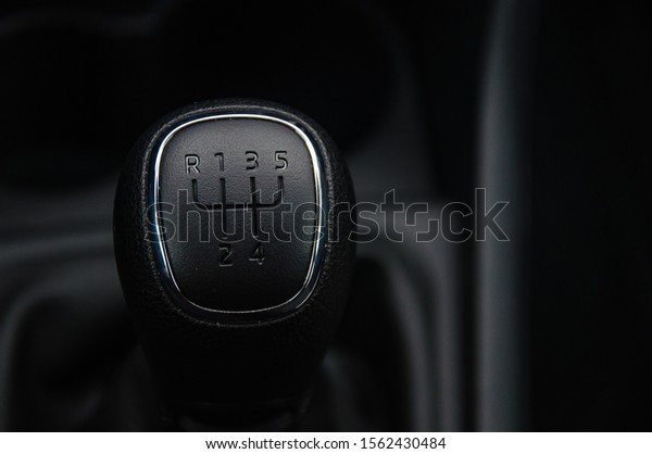Gear shift handle in a modern car. Manual\
transmission. The gear change\
lever