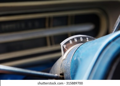 Gear shift selector or indicator on the steering column of a vintage automobile