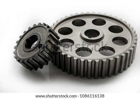 A gear wheel or pinion is a basic part of a gear train in the form of a disc with teeth on a cylindrical or conical surface meshing with the teeth of another gear