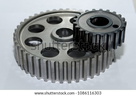 A gear wheel or pinion is a basic part of a gear train in the form of a disc with teeth on a cylindrical or conical surface meshing with the teeth of another gear