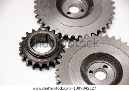 A gear wheel or pinion is a basic part of a gear train in the form of a disc with teeth on a cylindrical or conical surface meshing with the teeth of another gear