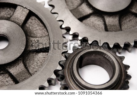 A gear wheel or pinion is a basic part of a gear train in the form of a disc with teeth on a cylindrical or conical surface meshing with the teeth of another gear