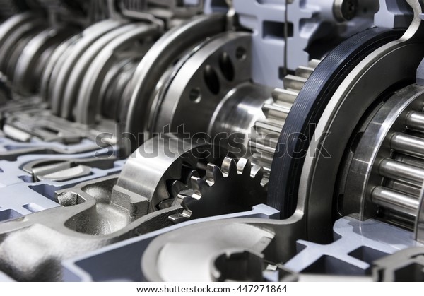 Gearbox cross-section, engine industry, sprockets,\
cogwheels and bearings of automotive transmission for oversize\
trucks, SUV, cargo, commercial and construction vehicles, selective\
focus 