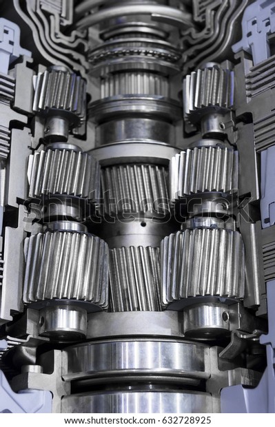 Gearbox cross-section, engine industry, sprockets,\
cogwheels and bearings of automotive transmission for oversize\
trucks, SUV, cargo, commercial and construction vehicles, selective\
focus