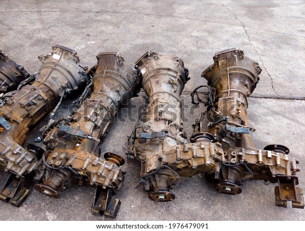 Gearboxes, old parts, second hand, used items,\
recycled, metal, engine on the\
floor.