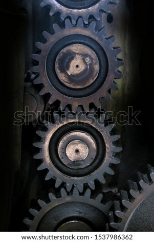 The gears of the employed hard worker's machine.