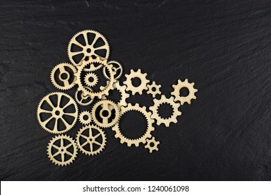 Gears on black background. Conceptual image of industry, mecanics, connection or team work. 