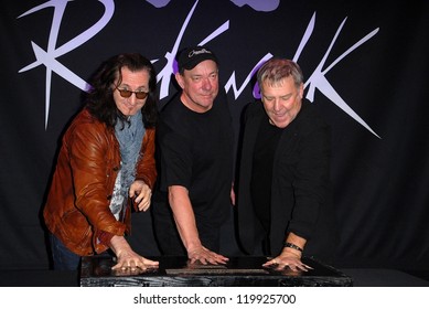 Geddy Lee, Neil Peart, Alex Lifeson At The RUSH Induction Into Guitar Center's RockWalk, Guitar Center, Los Angeles, CA 11-20-12