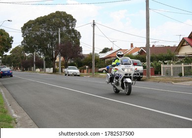 GEELONG, AUSTRALIA - MARCH 03, 2007: Australian Police Officer Riding A Motorcycle Patrolling The Street.