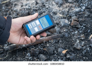 Geiger Counter With Radioactive Materials In The Background