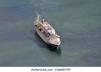 Geiranger, Norway - 07 July 2011: A Large Cruise Ship Full Of Tourists Sails On The Sea.