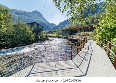 GEIRANGER, NORWAY - 2016 JUNE 14. Walking on the platform by the Storfossen waterfall at Geiranger heading to the Norwegian Fjord Centre (Norsk Fjordsenter) Museum in the summer