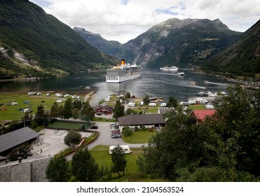 Geiranger- Norway- Circa August 2010. Big cruise ship from Costa Cruise Company anchored in the Geiranger Fjord. Scenic view of the tourist activity on the bay