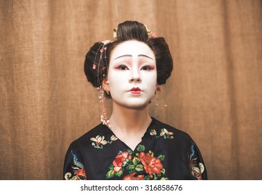 Geisha Makeup On Brown Background