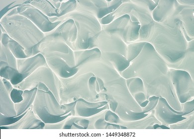 Gel collagen lubricant background transparent smudge gray. Photo.