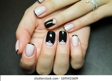 Gel manicure and French coating   design by hand gel paint black the hands fashionable girl