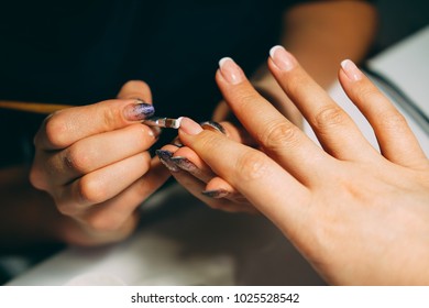 Gel nail extensions build up process. Women at beauty parlour doing manicure. - Shutterstock ID 1025528542