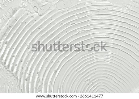 Gel texture with arch pattern on grey background