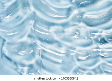 Gel texture. Sanitizer, alcohol gel, serum background. Skincare clear liquid cream smudge. Transparent beauty product sample close up