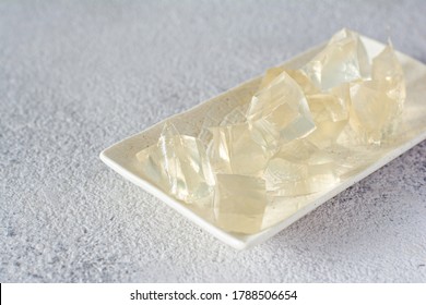 Gelatin, Agar-agar, Gelatinous Mass (cubes In The Form Of Crystals) On A Gray Background. Gelling Agent (collagen) For Culinary, Confectionery Products.