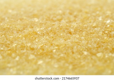 Gelatin, Yellow Powder Top View. Background, Texture Of Crystals Of Gelatin, Close-up. Dry Gelatin Texture, Top View. Dry Yellow Gelatin Powder, Top View. Pile Of Isinglass, Top View.