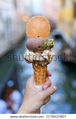 A gelato in hand along the Venetian Canals in Venice, Italy. delicious icecream