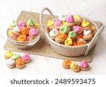 Gem Rose. Small round biscuits with colorful candy on top, usually this old school food is widely available when the holidays arrive.