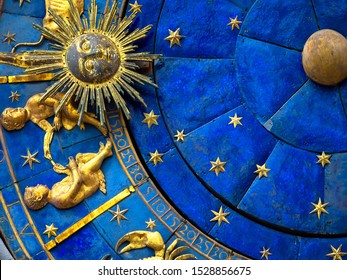 Gemini Astrological symbol on old clock, detail of Zodiac wheel with Sun and Twins. Golden sign of Gemini on star circle close-up. Concept of horoscope, Gemini, sky, may, medieval vintage mechanism.