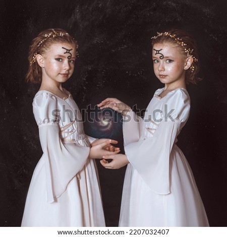 Gemini girls, as a symbol of the zodiac sign, hold the universe in their hands. One model in reflection