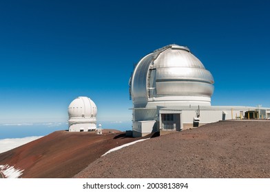 Gemini North Observatory on top of Mauna Kea mountain peak on Big Island of Hawaii, United States with deep blue sky and volcanic landscape