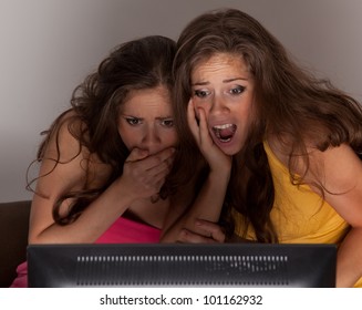 Gemini Sisters Watching A Horror Movie On TV