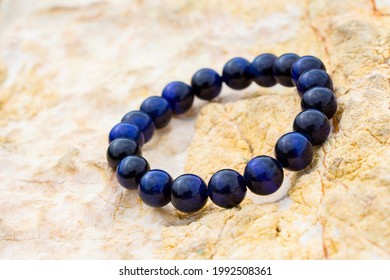 gemstone known as tiger eye or cat eye with a blue color contrasted with blue. , Blue Color Tigers Eye Stone