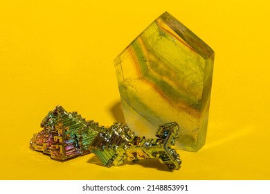 Gemstones Arranged On A Vibrant Yellow Construction Paper Background. 