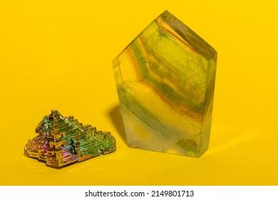 Gemstones Arranged On A Vibrant Yellow Construction Paper Background. 