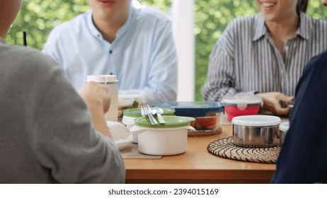 Gen Z asia people group save the planet earth relax eating food go green meal eco friendly glass lunch box reduce plastic waste free water bottle at table SDGs office. ESG net zero happy staff team. - Powered by Shutterstock