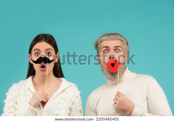 Gender\
discrimination and sexism. Male and female characters in gender\
symbols. Couple of woman with moustache and man with red lips.\
Identity transgender, gender\
stereotypes.
