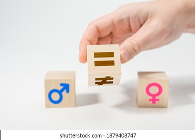 Gender Equality Concept On Wooden Cubes. Concepts Of Gender Equality. Hand Flip Wooden Cube With Symbol Unequal Change To Equal Sign. White Background