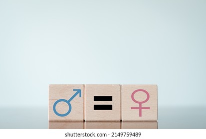 Gender Equality Concept.,Man,Woman,Equal Sign Icon On Wooden Cube With Copyspace.