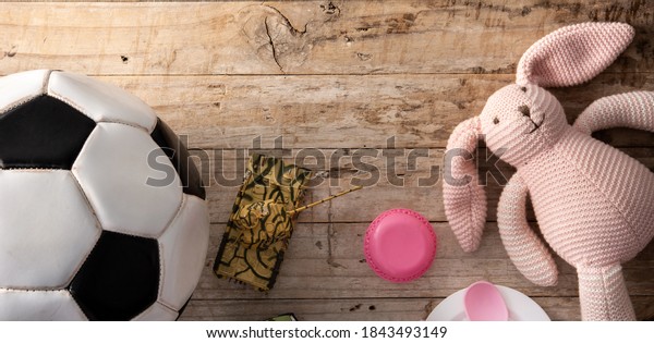 Gender stereotype\
toys on wooden\
background