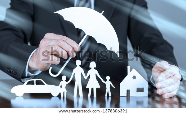 General agent protecting a family, a house and a\
car with his hands, light\
effect