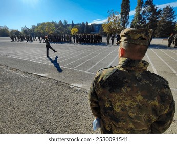 General in front of built cadets.Female cadet marching.Sunny day,military discipline, uniforms and strict order.Vasil Levski National Military University,Veliko Tarnovo, Bulgaria.October 10, 2024. - Powered by Shutterstock