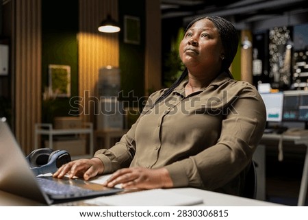 General manager engages in methodical planning after hours at the corporate office, envisioning ideas and reflecting on business outlooks to turn a challenging problem into a tactical solution
