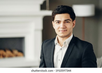 general manager. portrait of a lawyer in a bank looking at the camera smiling. a man in a business suit is in a modern, stylish office. - Shutterstock ID 1910597344