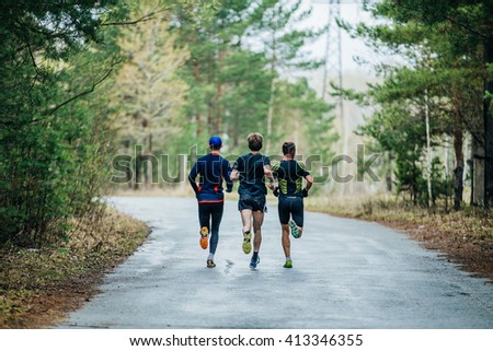 Similar – Image, Stock Photo Three trail runners in colorful attire running on a snowy mountain