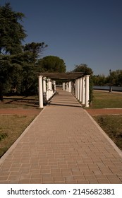 General San Martín Park In A Sunny Day. View Of The Walkway, Plants And Decorative White Columns.