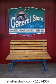 General Store Sign Behind Bench