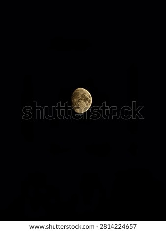A general view of an astronomical object (waxing moon) located centrally in a deep, black, cloudless sky. Suitable for astronomy, science, cosmology, night navigation, and concepts of silence and tranquility